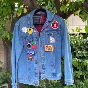 Jean jacket with patches.